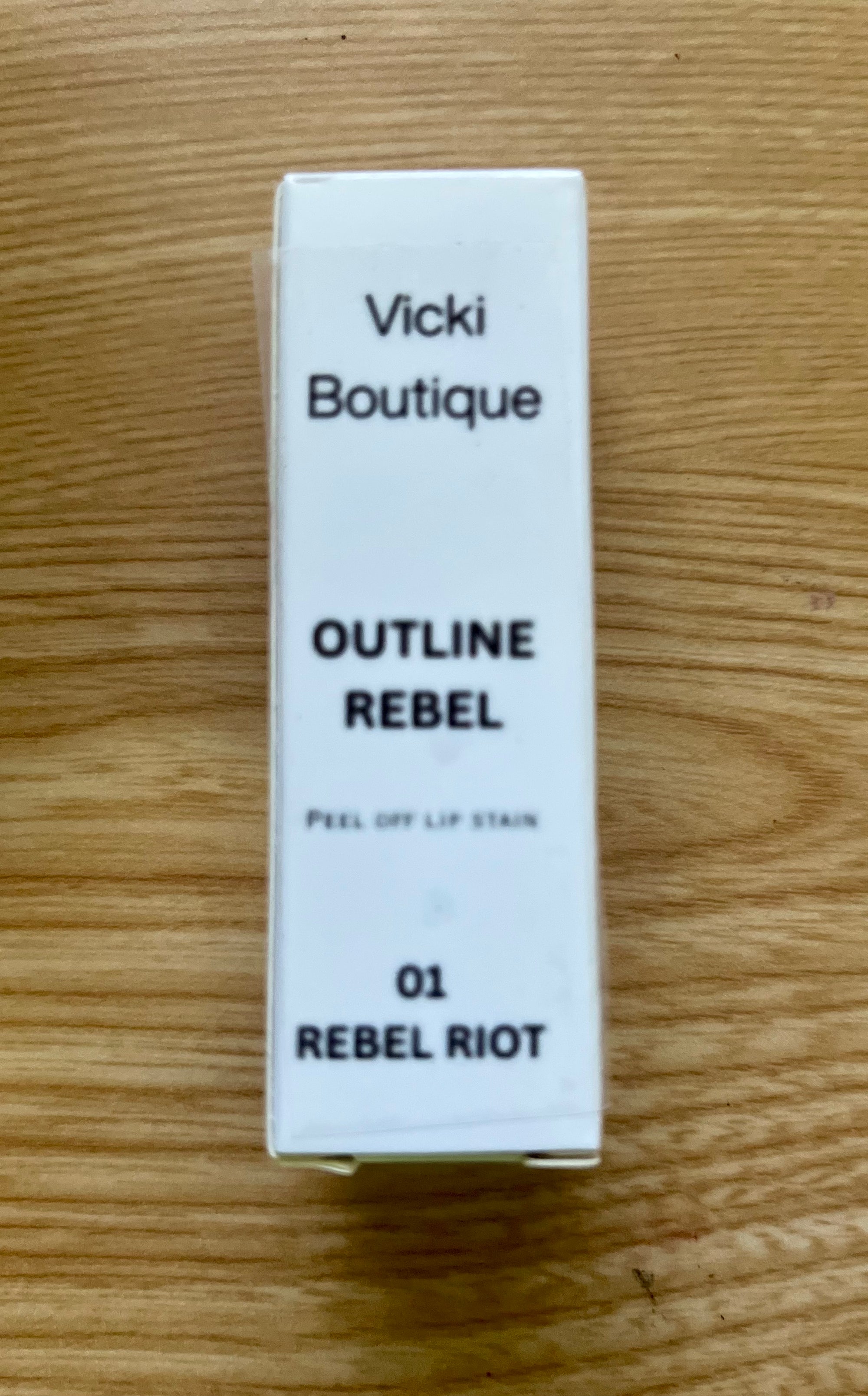 VP Boutique moisturizing peel off lip tint in shade 01 Rebel Riot with white packaging