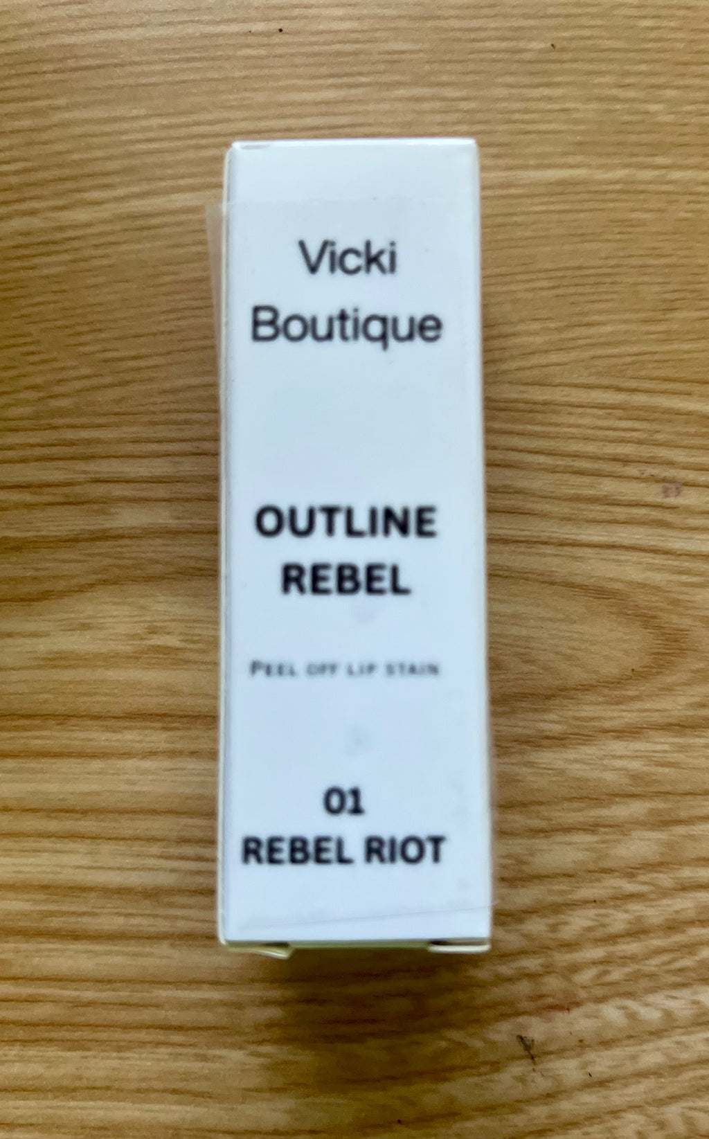 VP Boutique moisturizing peel off lip tint in shade 01 Rebel Riot with white packaging