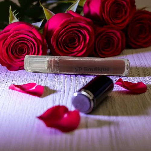 VP Boutique waterproof liquid lipstick with smudge proof formula displayed with red roses and petals